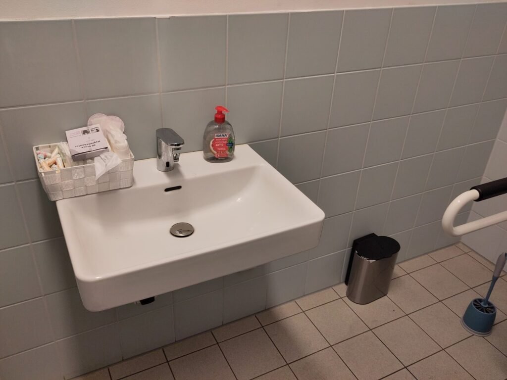 Menstrual hygiene products in an accessible bathroom of a school in Berlin, Germany