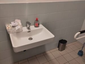 Menstrual hygiene products in an accessible bathroom of a school in Berlin, Germany